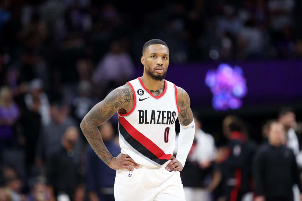 Damian Lillard #0 of the Portland Trail Blazers stands on the court during their game against the Sacramento Kings at Golden 1 Center on October 19, 2022 in Sacramento, California. NOTE TO USER: User expressly acknowledges and agrees that, by downloading and or using this photograph, User is consenting to the terms and conditions of the Getty Images License Agreement. 